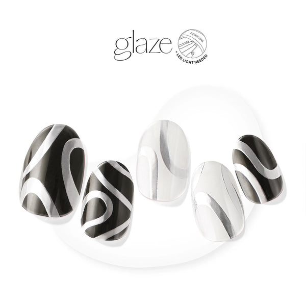 Semi-cured black & white gel nail strips featuring silver foil line art with mega volume & maximum shine.
