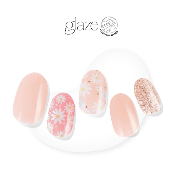 Dashing Diva GLAZE baby pink semi cured gel nail strips with daisy floral print and glitter accents.
