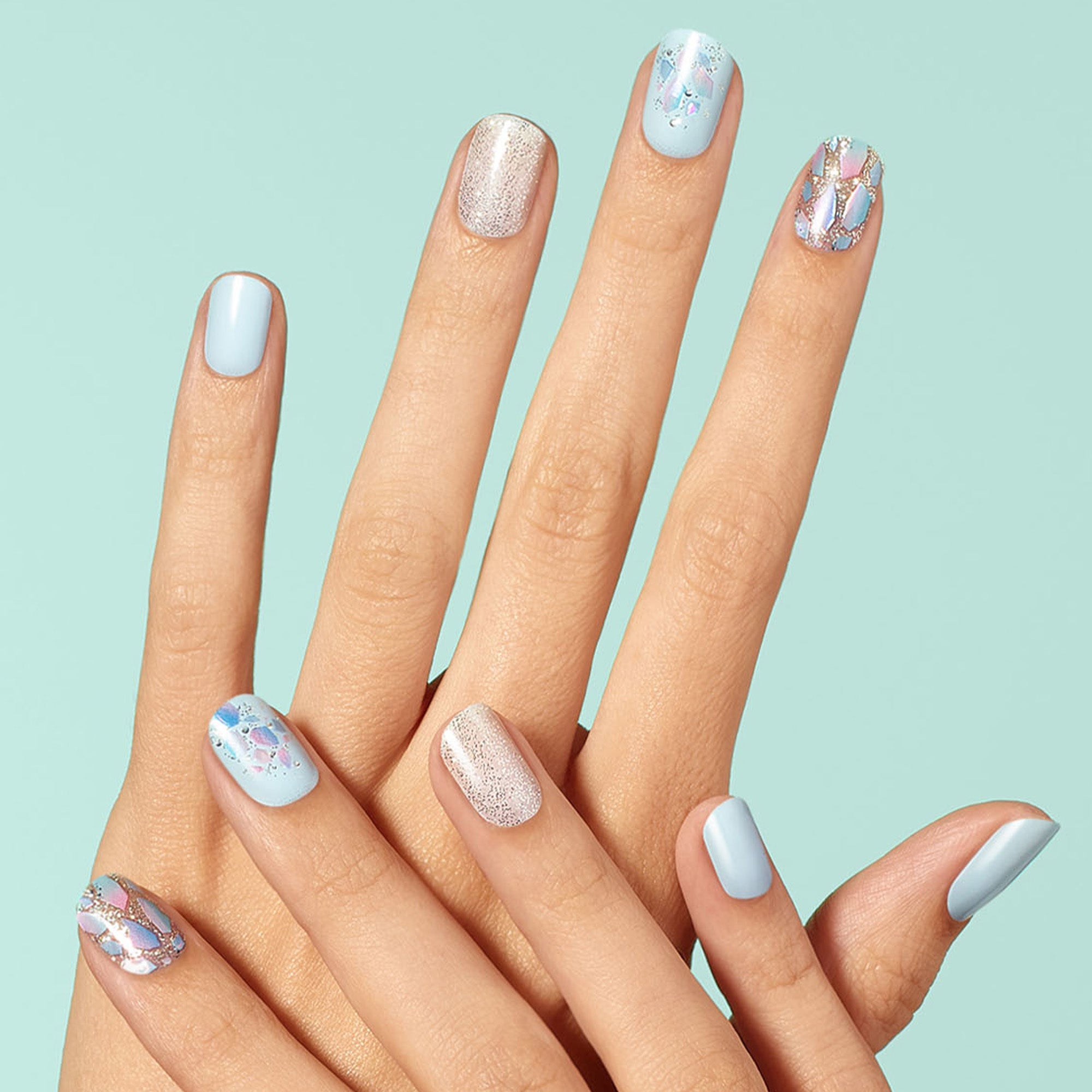 Dashing Diva GLOSS Nuclear Nova light blue gel nail strips with mosaic, shattered glass, and glitter accents.