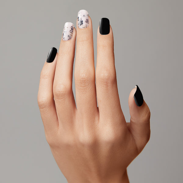  Semi-cured black & soft grey gel nail strips featuring gold foil and floral accents with mega volume and maximum shine.