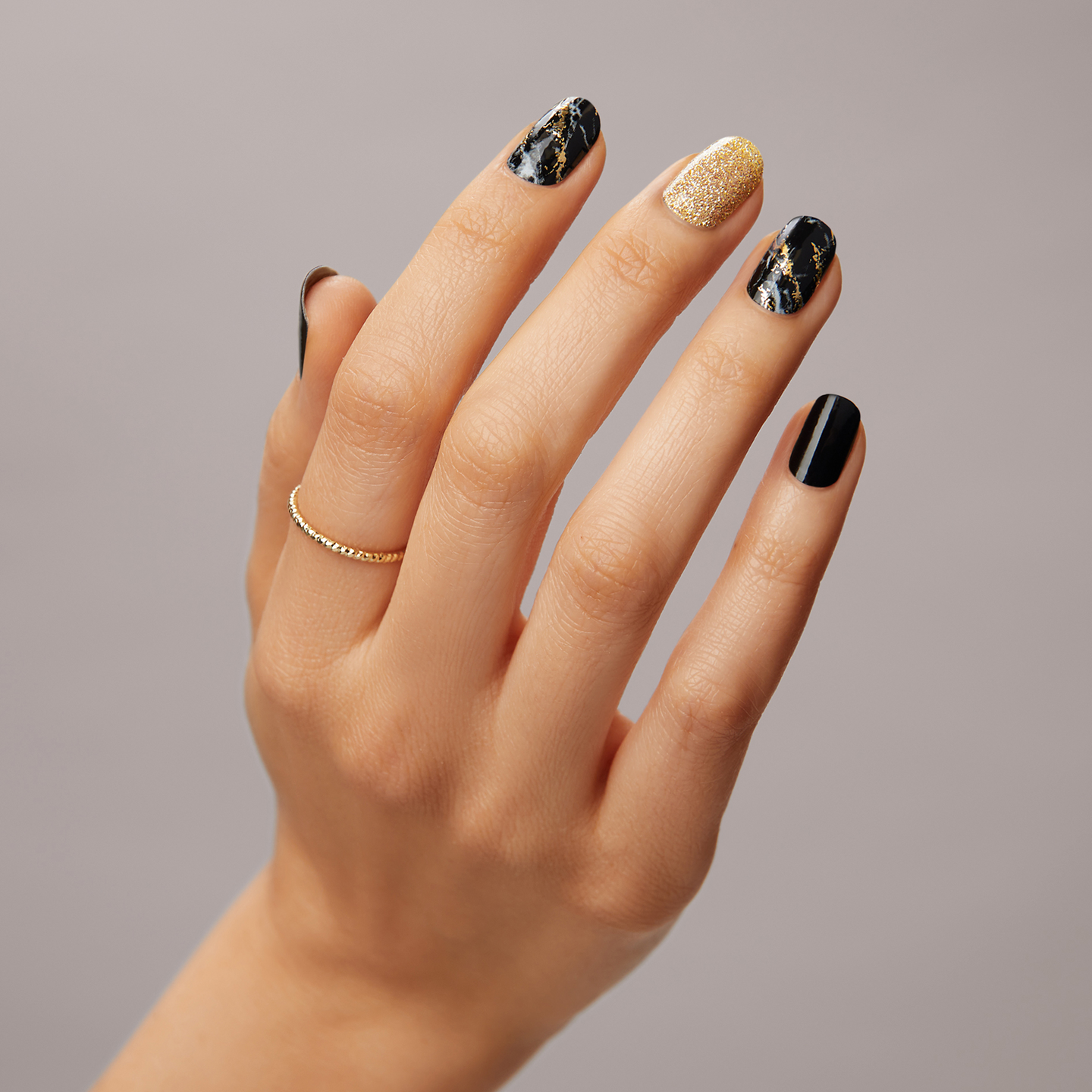 Black Nails with Gold Accents Shine