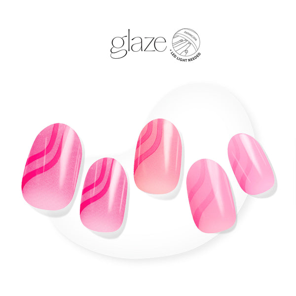 Multi-shade pink gel nail strips featuring wavy line art & ombré accents with mega volume & maximum shine.