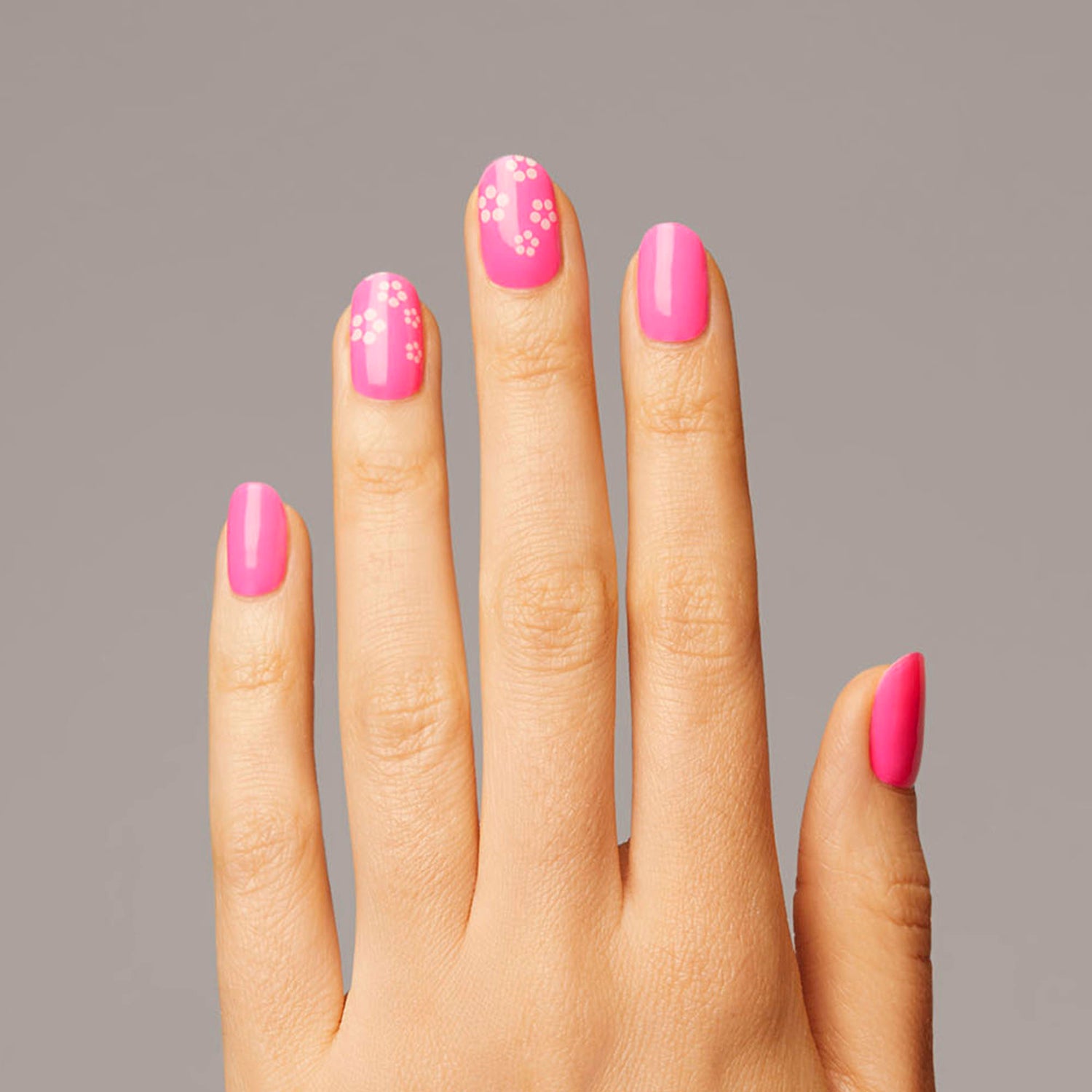 Neon pink gel nail strips featuring pop flower accents with mega volume & maximum shine.