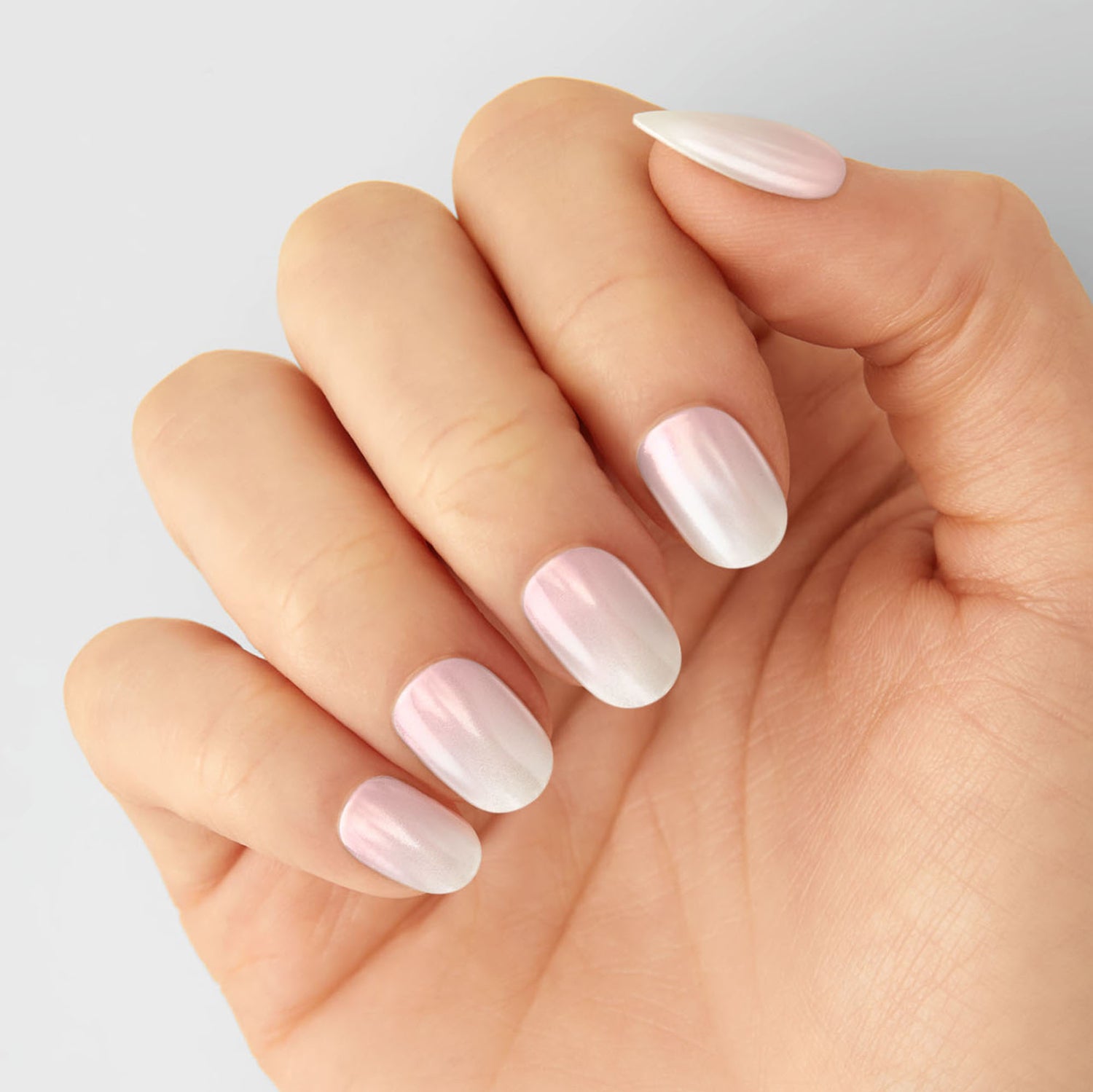 Semi-cured pink-to-white gradient gel nail strips featuring a shimmery chrome finish with mega volume & maximum shine.