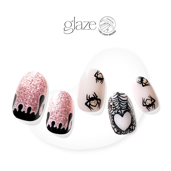  Your manifestations seem a little wicked… Semi-cured dusty pink gel nail strips featuring spiderwebs, spider icons, blood-dripping accents, and champagne pink glitter with mega volume & maximum shine.