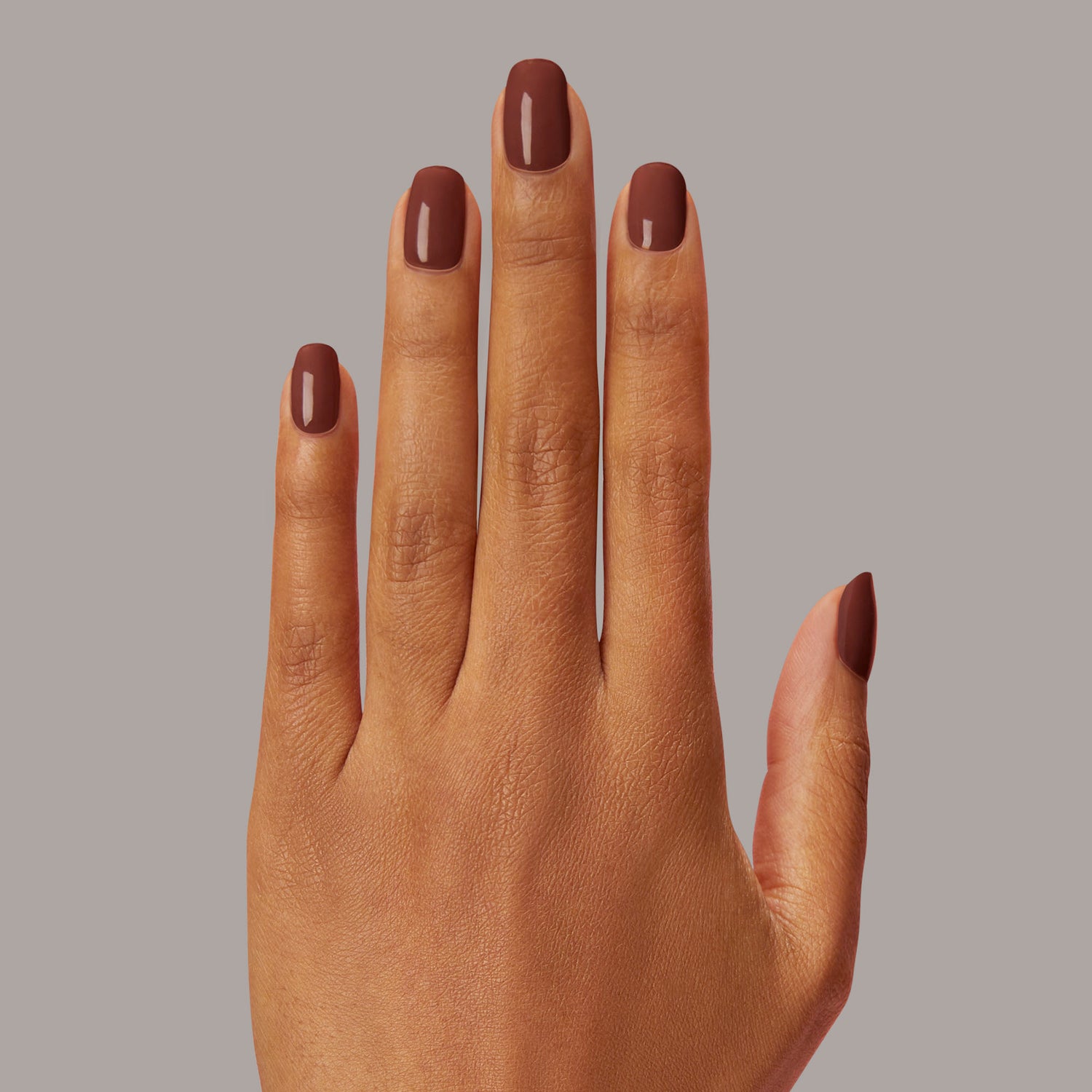 Semi-cured, warm, dark brown gel nail strips with mega volume & an opaque finish.