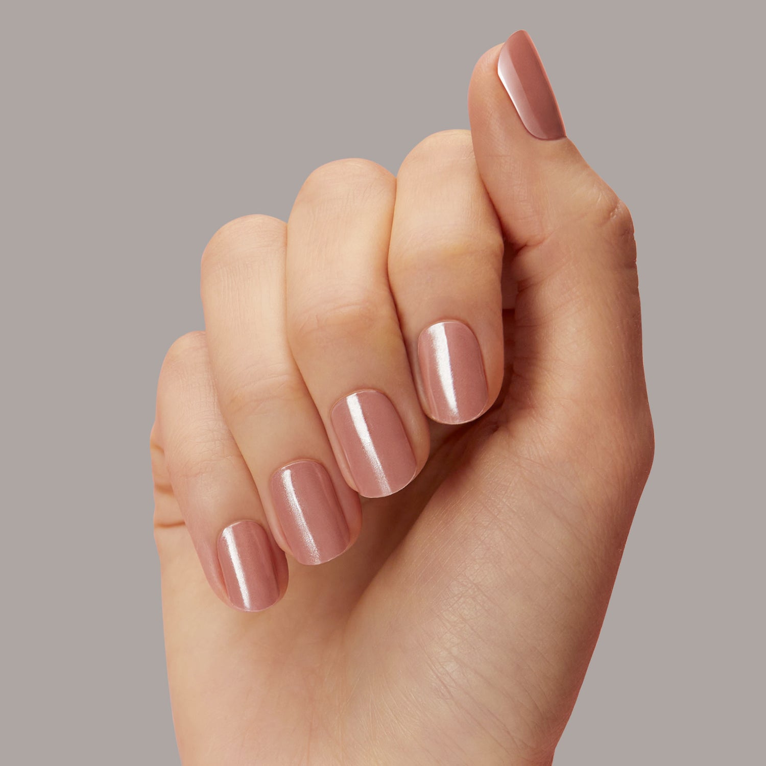  Semi-cured, nude rose gel nail strips with mega volume & a shimmery chrome finish.