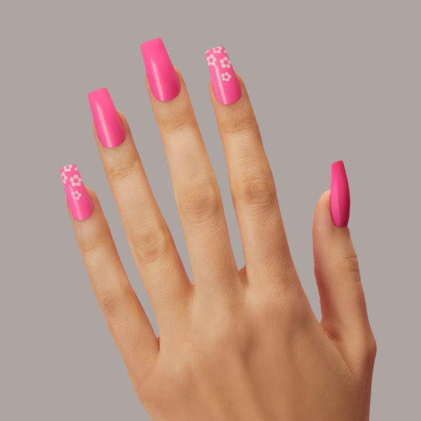 Long length, coffin shape, glossy finish. Neon pink glue-on gel nails 