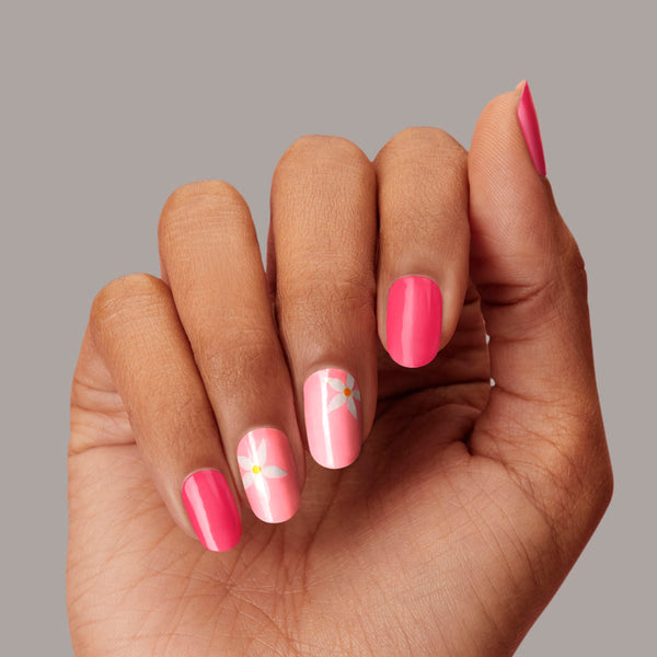 Hot pink & light pink nail strips featuring white floral accents with a glossy, high-shine finish.