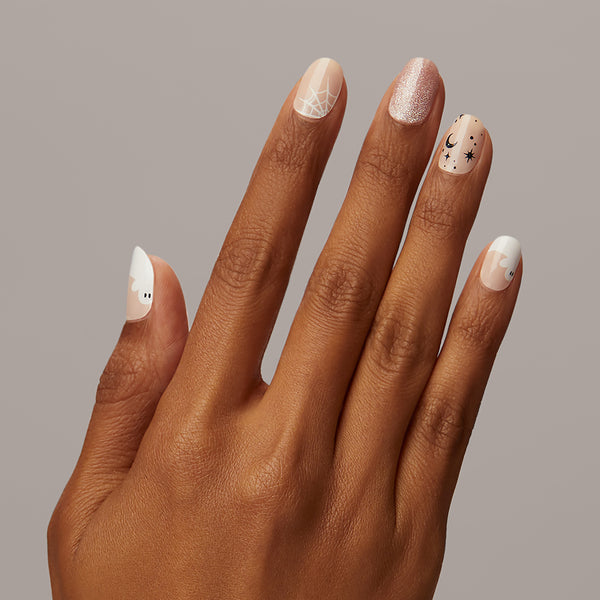  Scary how charming these are, isn't it? Nude gel nail strips featuring ghost french tips, starry accents, iridescent glitter, and a nude pink shimmery velvet effect with a double gel formula for an ultra-smooth finish. 