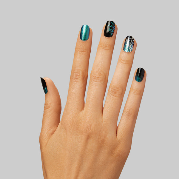  Creep it cool, this glamour is meant to look [super]natural. Black gel nail strips featuring green shimmery chrome, iridescent glitter, and silver foil spiderwebs with a double gel formula for an ultra-smooth finish.