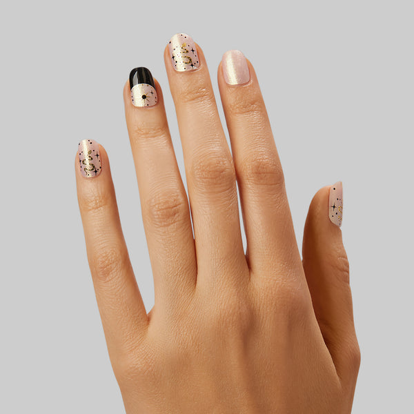  What's your sign? Iridescent pink/gold gel nail strips featuring a shimmery velvet effect, gold foil details, and black french tips with a double gel formula for an ultra-smooth finish.