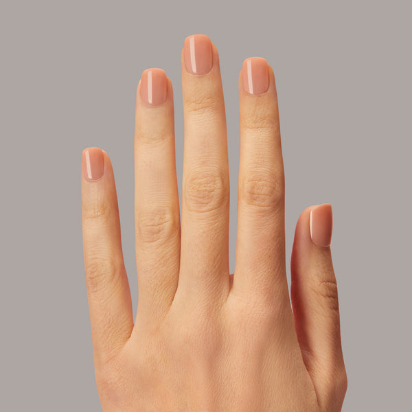 Short length, square shape, warm rose press-on gel nails featuring a sheer, glossy finish.
