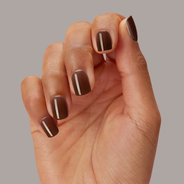 Short length, square shape, rich chocolate brown press-on gel nails featuring a sheer, glossy finish.