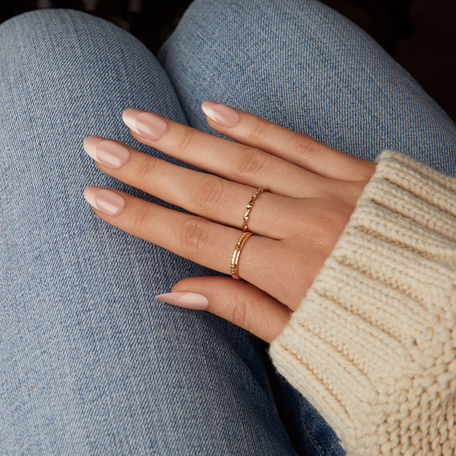 Medium length, almond shape, glossy finish. Tan & beige press-on gel nails featuring an illusion french style design.