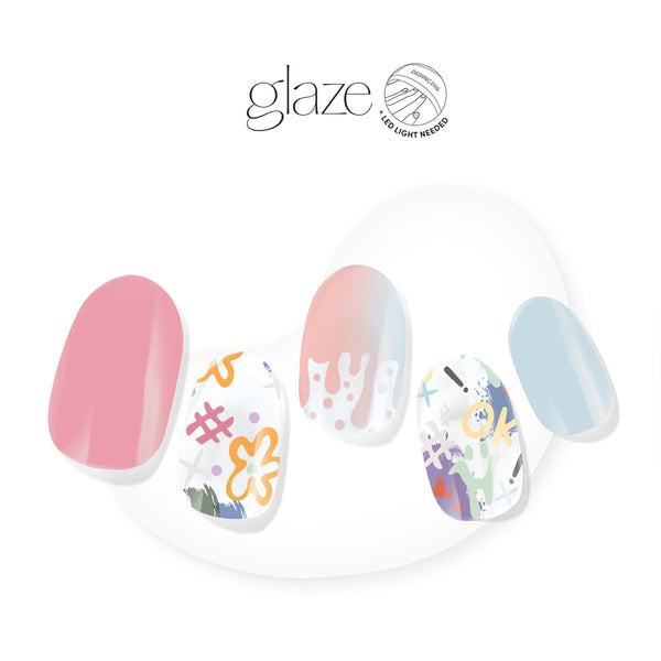 Dashing Diva GLAZE pink and blue semi cured gel nail strips with graffiti graphics accents.