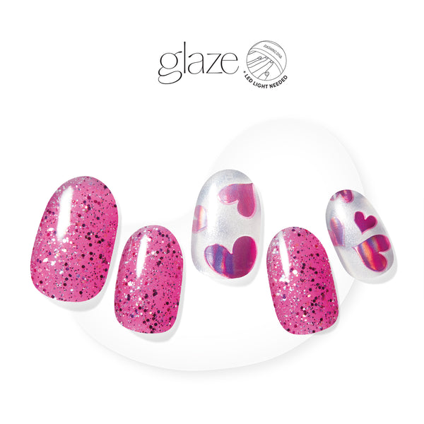 Semi-cured fuchsia pink gel nail strips featuring multi-reflective glitter and love-filled hearts 