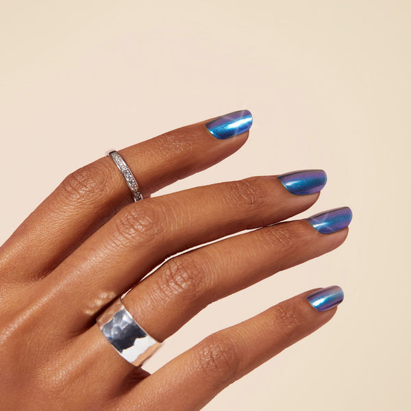Semi-cured blue metallic chrome gel nail strips with mega volume & maximum shine.