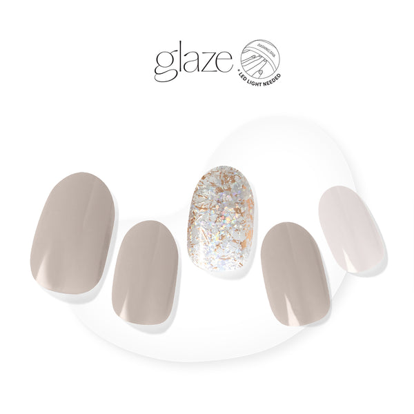 Dashing Diva GLAZE gray semi cured gel nail strips with gold foil accents.