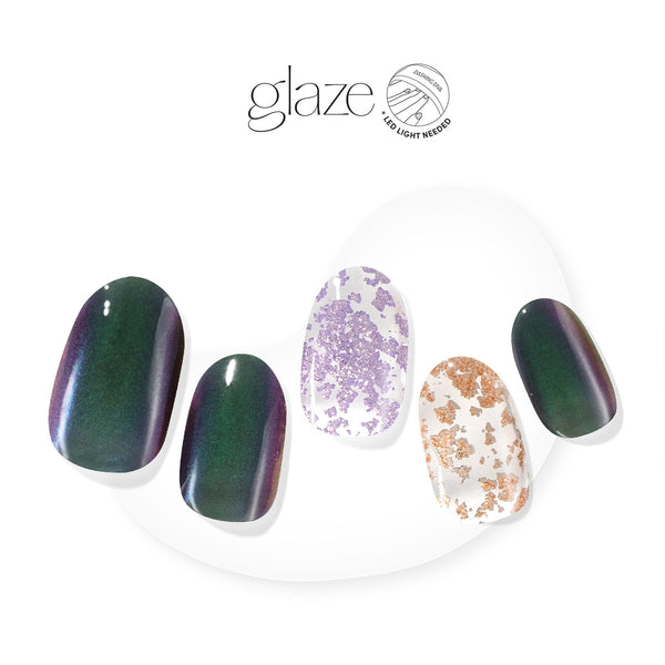 Dashing Diva GLAZE iridescent green semi-cured gel nail strips with lavender and gold foil accents.