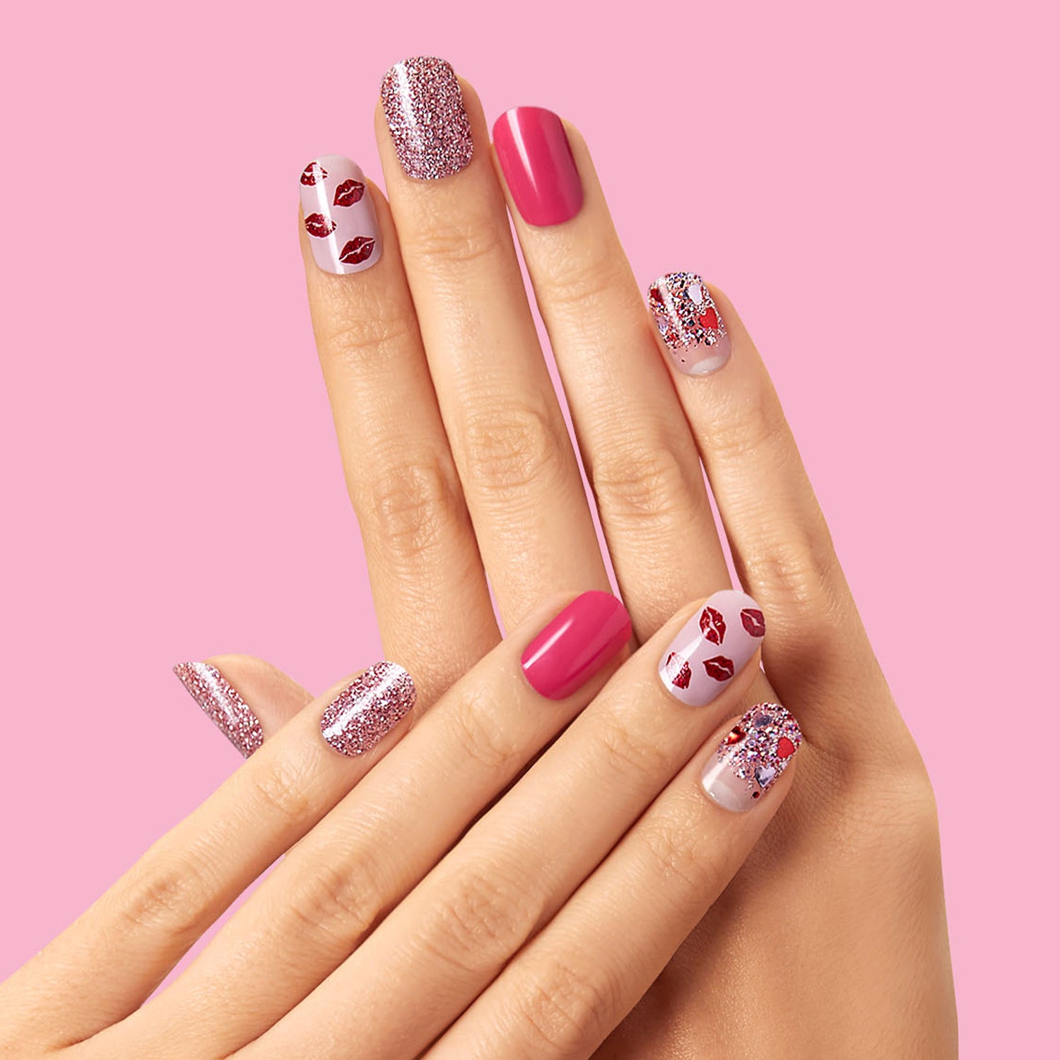 Multichromatic pink gel strips featuring glitter, lipstick kisses, and flirty confetti glitter.