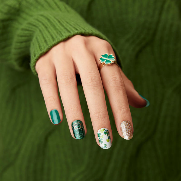 Shamrock green nail strips featuring green four-leaf clovers, gold glitter, and belt buckle accents with a glossy, high-shine finish.