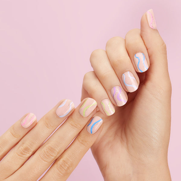  Nude nail strips featuring blue, pink, and green pastel waves with a glossy, high-shine finish.
