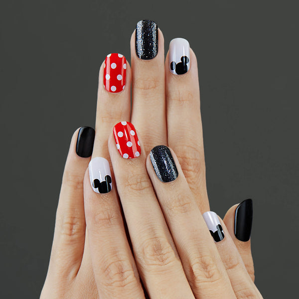 Black gel nail strips with red polka dots, mickey ears, and black glitter accents with a glossy, high-shine finish. 