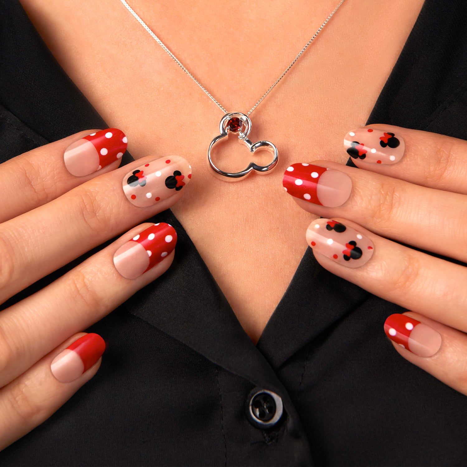 Red French gel nail strips featuring red and white polka dots, pink and black Mickey, and Minnie ears 