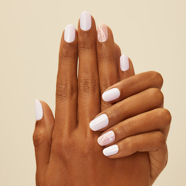 Soft white nail strips featuring heart accents and light pink & white swirls with a glossy, high-shine finish.