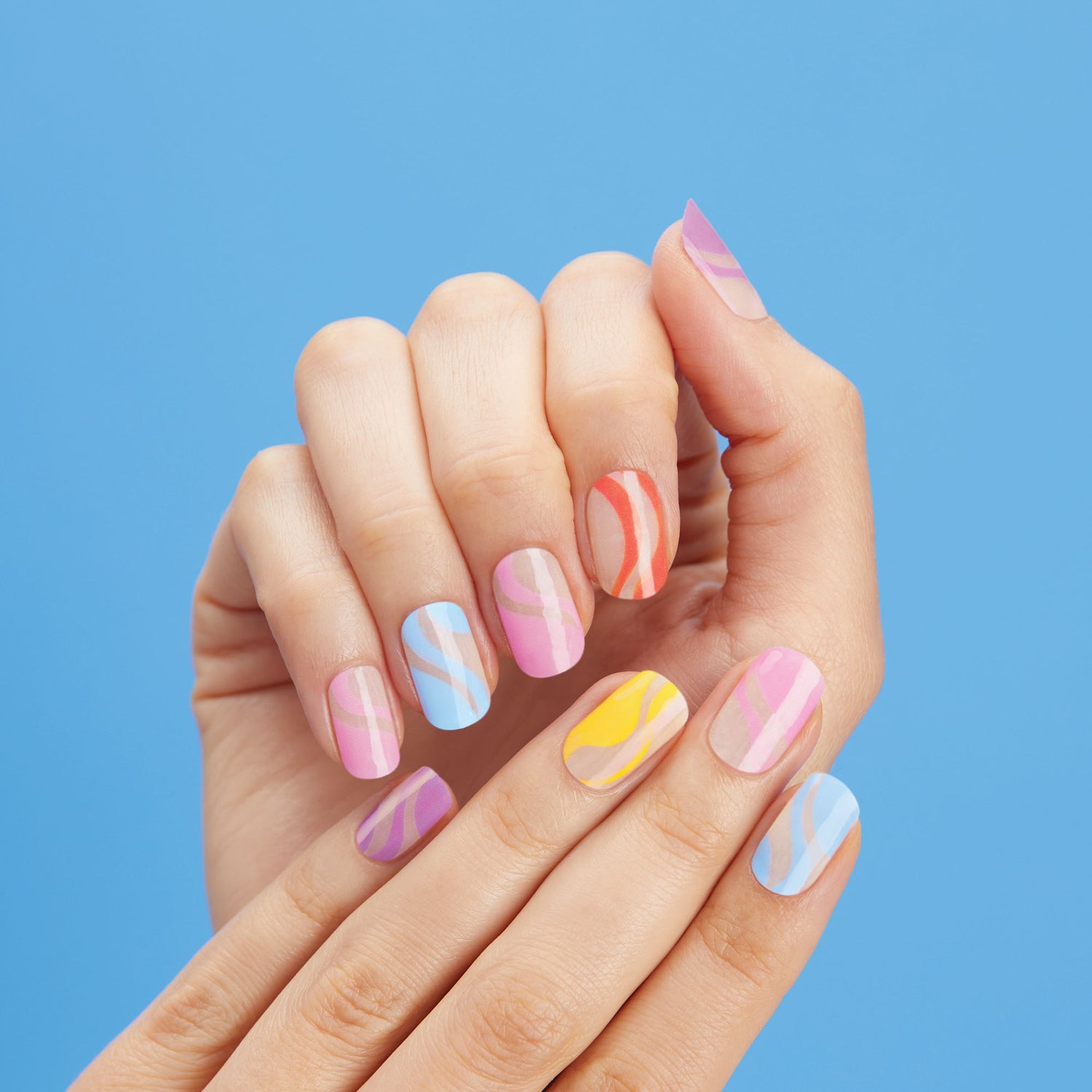  Sheer nude gel nail strips featuring multicolor, pastel abstract swirls with a double gel formula for an ultra-smooth finish.