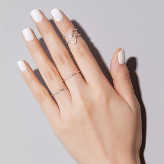 Short length, square shape, glossy finish milky white press-on artificial nails.