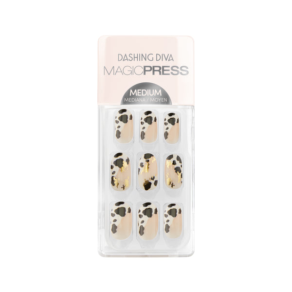 Dashing Diva MAGIC PRESS medium, oval cow print asymmetrical french nails with gold foil accents.