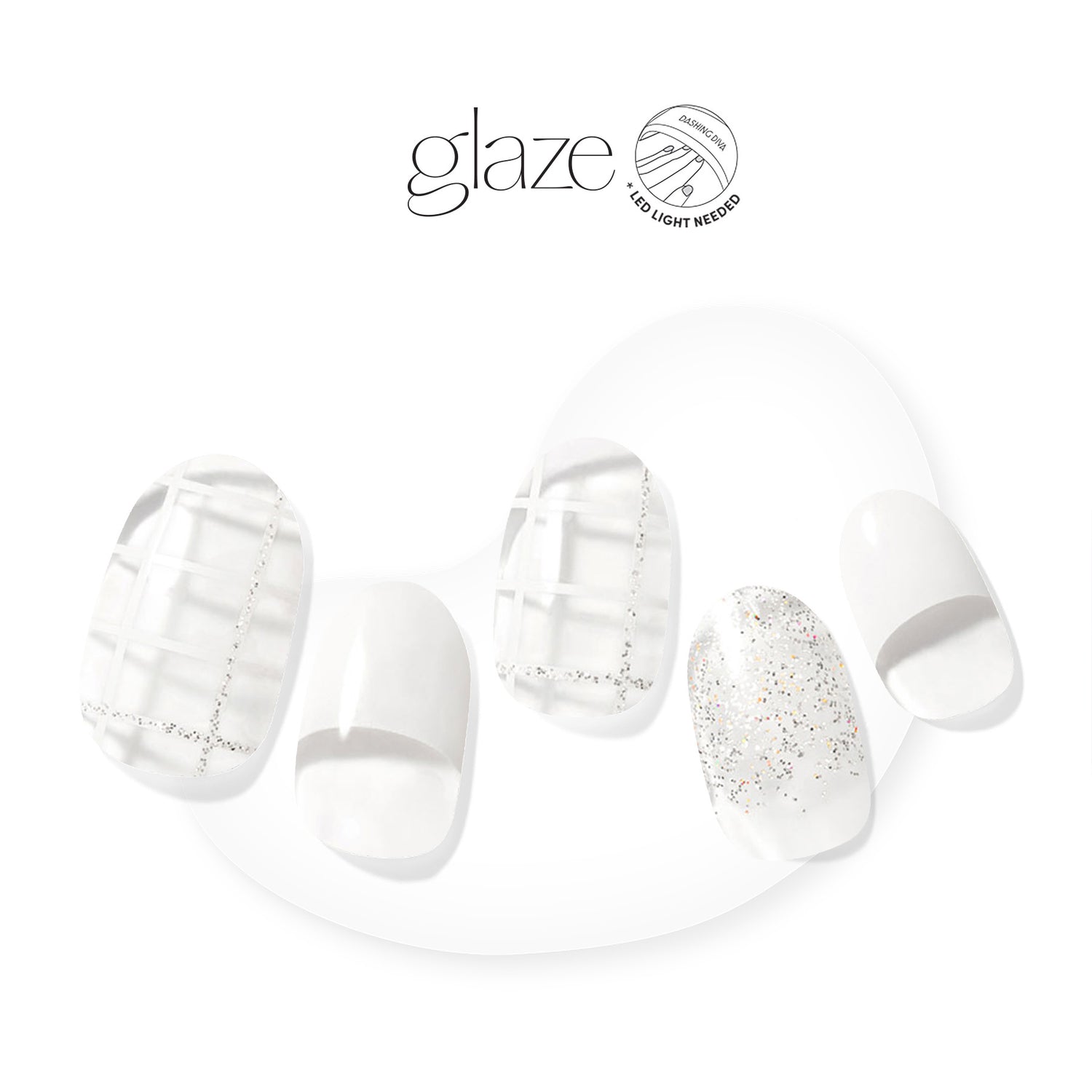 Dashing Diva GLAZE negative space white semi cured gel nail strips with geometric lines, non traditional French tips and glitter accents.